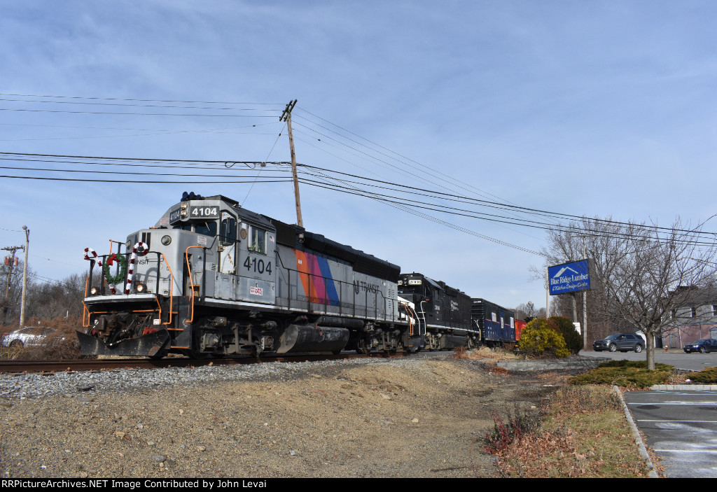 The NJT 4104 and C&D 2006 lead the DRRV Toys for Tots Train across Rt. 46 in the Kenvil part